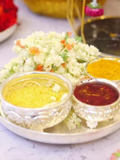 The small details are what make a ceremony feel complete. I prepare these traditional silver plates with all the essential pooja items like haldi, kumkum, and fragrant jasmine flowers, ensuring everything is ready for your rituals.