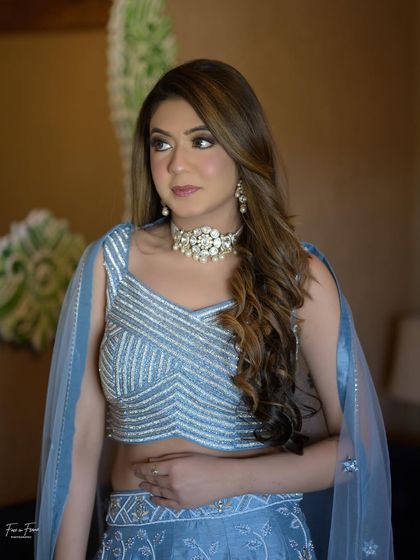 Another shot of this coordinated look. The makeup is glamorous but not overpowering, creating a harmonious and elegant style.