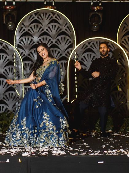 A snapshot of pure joy during the couple's sangeet performance. Their energy and smiles say it all.