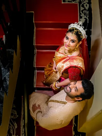 I love finding unique perspectives. This top-down shot of a couple on a staircase adds a creative, storybook feel to their wedding portraits, turning a simple moment into a memorable piece of art.