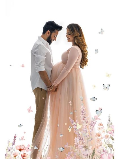 A whimsical story comes to life with this couple's portrait. The soft pink gown, florals, and floating butterflies create a truly magical memory.