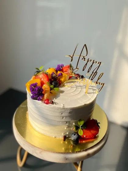 Nothing beats the taste of a fresh fruit cake. I top this light and airy cake with a colorful assortment of seasonal fruits like strawberries, blueberries, and mango for a naturally sweet and beautiful finish.