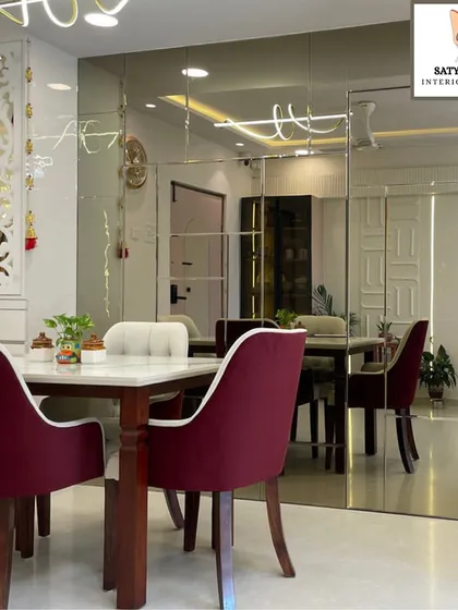 This view highlights the seamless flow between the dining area and the rest of the living space, unified by a consistent color palette and luxurious finishes.