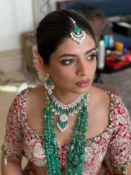 A close-up of a stunning bride, showcasing the details of her wedding day makeup. I used warm tones and a soft-focus technique to create a timeless look, ensuring her skin looked absolutely flawless and radiant from every angle.