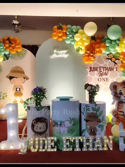 For Jude Ethan's 'Wild One' party, I created a friendly and inviting jungle scene. This setup includes adorable, life-sized cutouts of a lion, tiger, elephant, and zebra, a large light-up number '1', and marquee letters for the name, all set against a custom backdrop and framed by organic balloon arrangements.