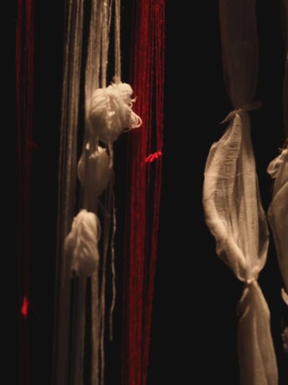 The mix of red and white threads, thick and thin, hanging in the dark. My sound design aimed to mirror this visual chaos, weaving together different sonic textures to build a sense of unease for the audience.