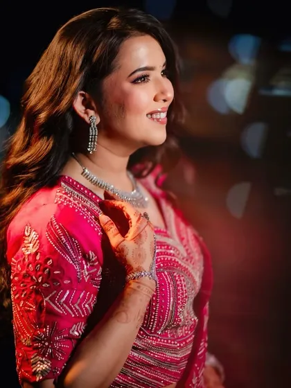 A candid, happy moment from the Roka. The makeup looks stunning even in professional lighting with bokeh effects, highlighting its photogenic quality.
