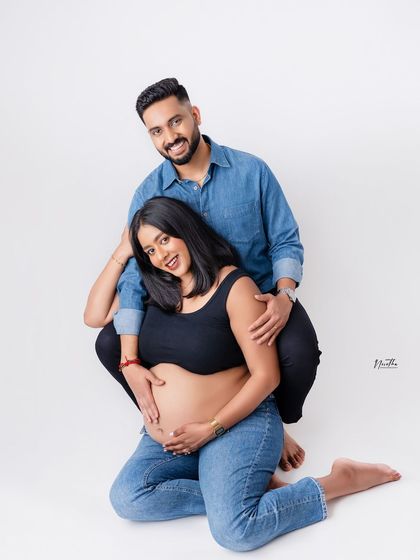 A fun and modern studio maternity pose for a couple. My goal is to make you feel comfortable and capture your unique personalities during the shoot.