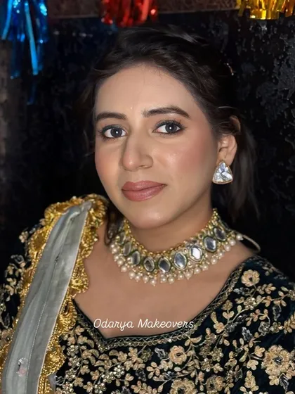 Another angle of this glowy party makeup. The skin looks radiant, and the nude lip keeps the look fresh and modern.