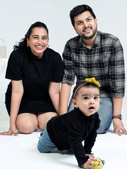 This photo, taken a year later, shows how much Gauri has grown. Paired with the newborn photo, it creates a powerful "then and now" story of our family's first year.