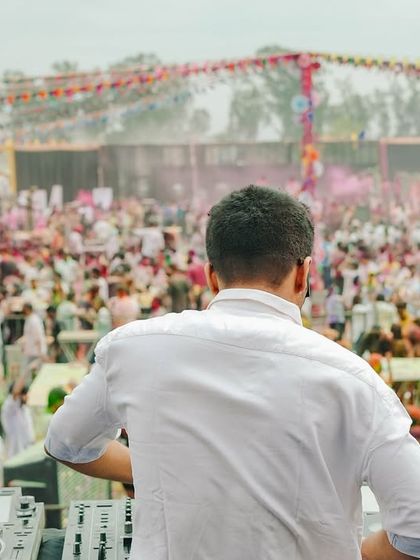 A view from my perspective, looking out at a sea of people during a Holi festival. This is the energy that fuels my performance.