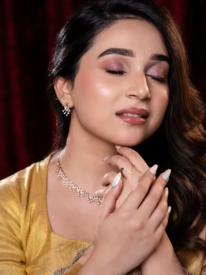 This is my signature soft glam look. I focused on creating luminous skin, soft rosy eyeshadow, and a natural lip tint that enhances, rather than covers. This style is perfect for clients who want to look like the best version of themselves.