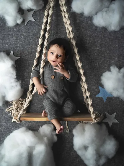 Swinging in a sweet dreamland among the clouds and stars. My creative themed sessions are designed to be whimsical and imaginative, turning your baby's portrait into a little piece of art.