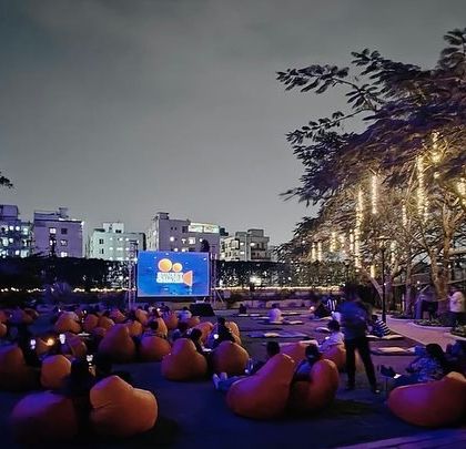 Our open-air cinema setup in Pune, with the city lights twinkling in the distance. It's a perfect escape from the everyday hustle.