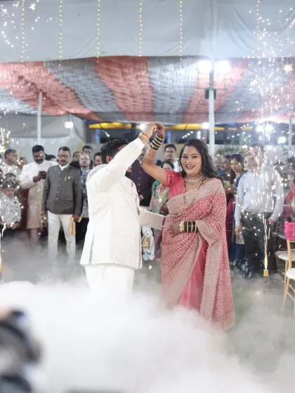 A magical moment on the dance floor. The bride's reception makeup is designed to be both glamorous and long-lasting, with a touch of sparkle to catch the light.