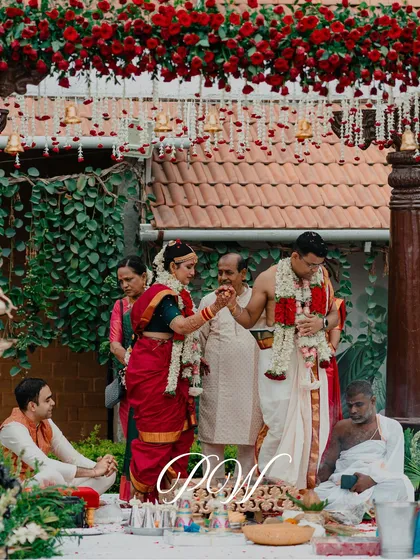 The sacred Kanyadaanam ritual, where the father places his daughter's hand in the groom's. Our mandap designs ensure these important moments are framed beautifully.