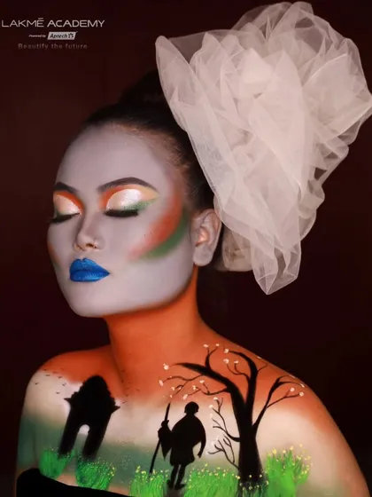 A side profile of the creative Independence Day makeup, showing the seamless blend of colors across the face and chest. Our courses teach students how to use the human body as a canvas.