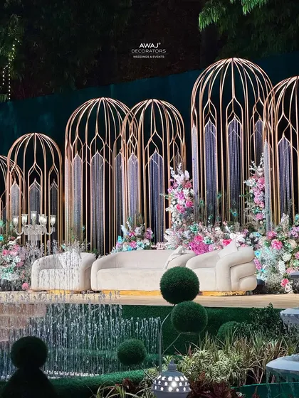 A beautiful perspective of the stage from across the integrated water fountains, adding a dynamic and serene element to the grand design.