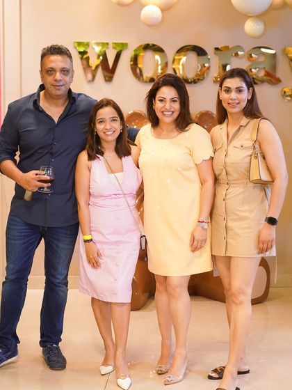 Guests enjoying a drink and posing for a photo at our stylish venue. We offer a five-star ambiance for all your celebrations.