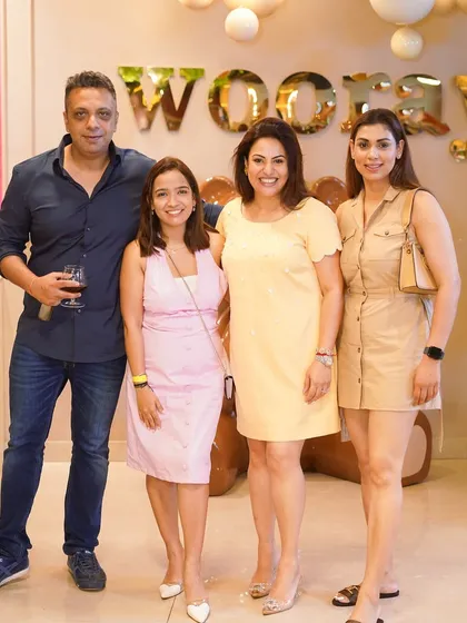 Guests enjoying a drink and posing for a photo at our stylish venue. We offer a five-star ambiance for all your celebrations.