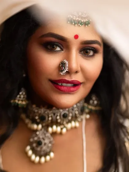 This is a beautiful close-up of one of my silver-like oxidized jewellery sets. The combination of the intricate choker, matching nose ring, and maang tikka creates a bold and artistic look, perfect for a modern lehenga or a unique sangeet style.