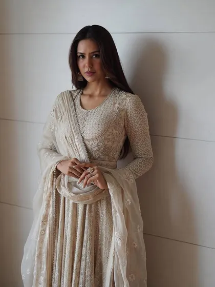 Grace in every gaze, a story in every stitch. Sonam Bajwa looks ethereal in this stunning white chikankari anarkali by Tarun Tahiliani, a timeless piece of Indian ethnic wear.