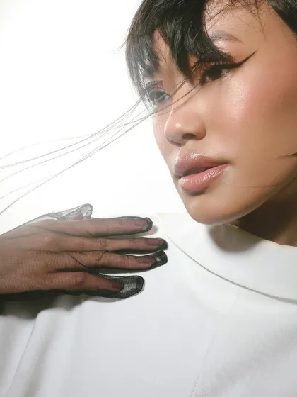 Lined with precision, defined with style. A close-up on the artistic eyeliner, showcasing the clean lines and creative concept.