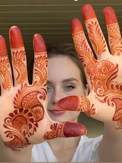 The same guest, now showing off the beautiful, rich stain of the natural henna a day later. This is the result of using only the best, chemical-free paste.