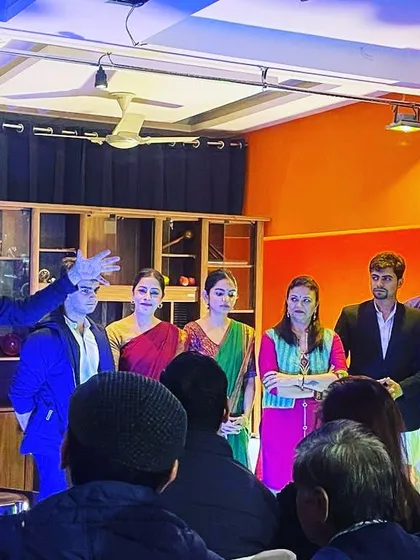 Our director, an NSD alumnus, guiding the actors on stage after a performance. We believe in continuous feedback and improvement.