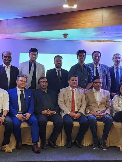 A group photograph with fellow dermatologists at the Novology brand launch event. Collaborating with peers is essential for staying at the forefront of dermatological science and innovation.