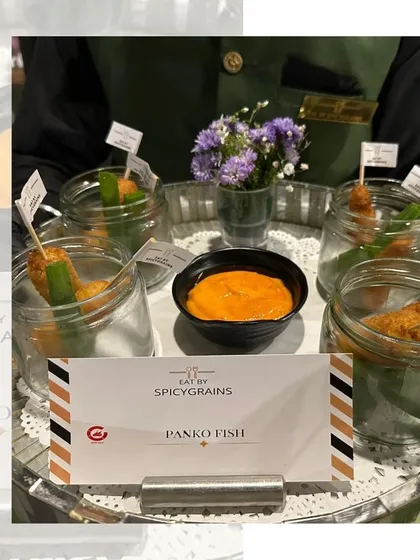 Crispy Panko Fish served in individual glass jars with a dipping sauce. A modern and stylish presentation for a classic fried fish appetizer.