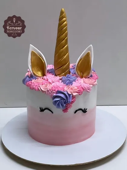 A sweet unicorn theme cake in a Belgium chocolate flavour. This cake features a beautiful unicorn with a colourful mane, a golden horn, and rosy pink cheeks.