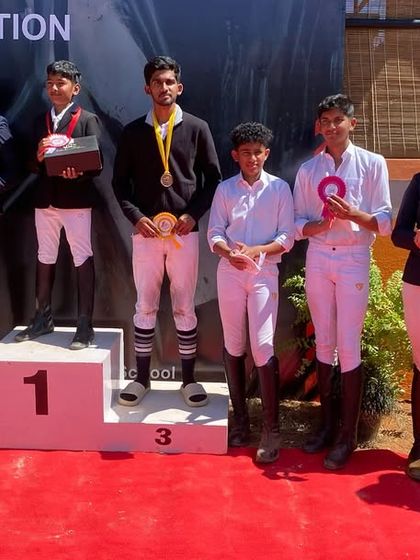 Our riders celebrating their wins at the Karnataka State Equestrian Championship. This picture captures the team spirit and success that defines Zippy.