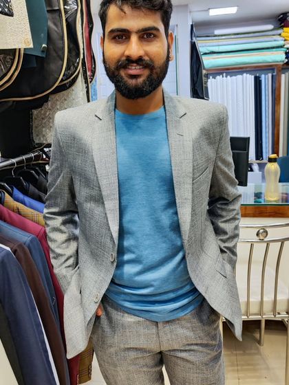 A collection of our clients in their custom-tailored formal suits, showcasing different fabrics and fits for various professional and formal occasions.