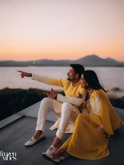 Pia and Zubin watch the sunset over the serene waters at Sula Vineyards. I love using grand landscapes to frame a couple's story, making them the heroes of their own cinematic romance.