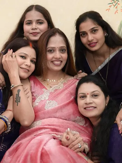 My academy is more than just a classroom; it's a family. This is one of my favorite pictures, a moment of pure joy and connection with my students on their graduation day.
