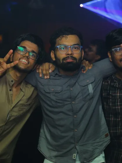 The boys are out for a good time. A group of friends posing for a photo during my set.
