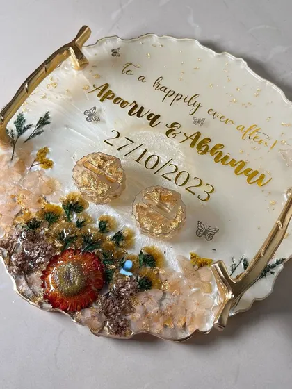 A top-down view of the elegant tray, showcasing the balance between the floral arrangement and the personalized text.