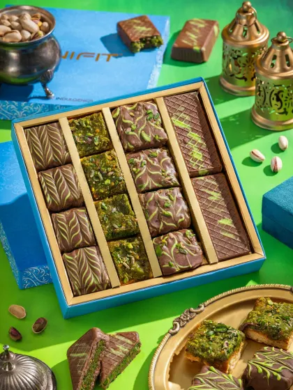 A festive gift box of pistachio-covered sweets from Unifit, shot with bright, celebratory colors.