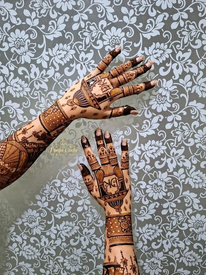 A lovely back-hand design featuring the couple's initials in a beautiful monogram, surrounded by traditional patterns.