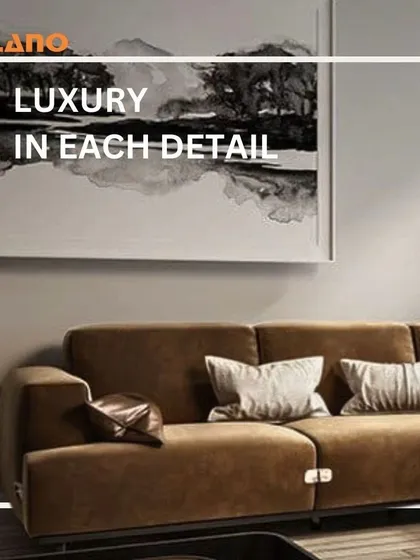 We believe in luxury in every detail. This image shows a modern brown sofa in a well-appointed living room, reflecting our ability to create complete, cohesive looks.