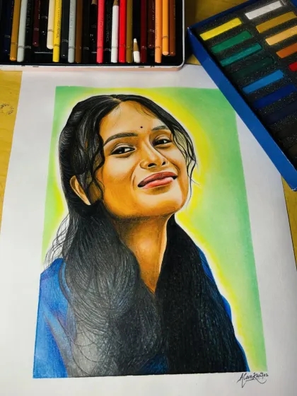 A closer look at the finished 50-hour color portrait. You can see the fine details in the hair and the smooth blending of colors on the face, all done with professional Brustro, Camlin, and Doms pencils.