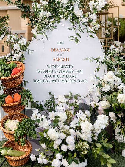 The decor for the Sangeet, with its white florals and fresh vegetables, provided a beautiful and unique backdrop for the couple's pastel and floral-themed outfits.