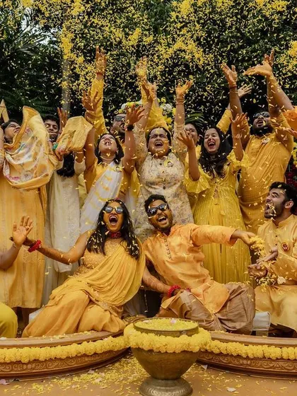 The vibrant, chaotic fun of a Haldi ceremony. This shot captures the explosion of joy, color, and laughter as friends and family celebrate together, showing the high-energy moments we love to film.