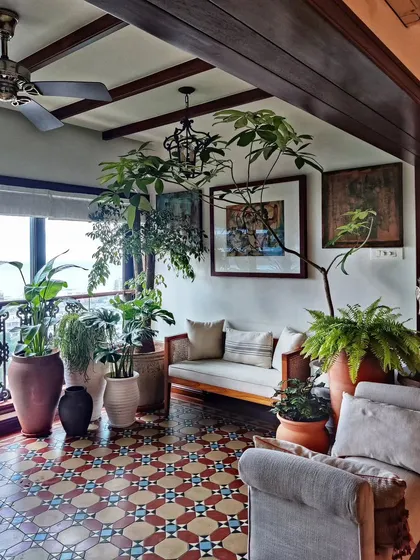 A snippet from one of the most charming homes we've worked on. The space was already stunning, and we added layers of green in terracotta pots to enhance its earthy, old-world magic.