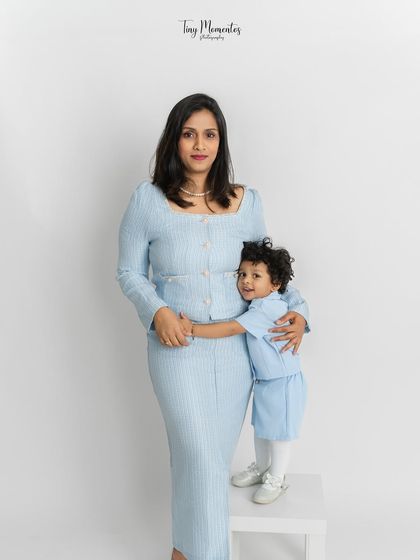 A warm embrace between mother and child. This pose highlights the protective and loving nature of a mother's hug, creating a truly heartfelt image.