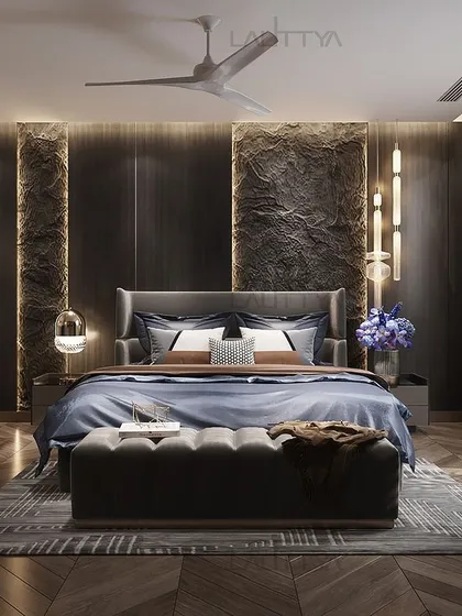 Crafted for comfort and designed for dreams, this luxury son's bedroom features a dark, moody palette. The textured wall behind the bed, modern pendant lights, and a dedicated study nook create a sophisticated and functional space.