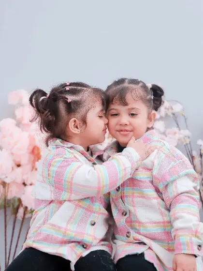 The sweet, secret language of sisters. We set up a simple, cozy space in our studio and just let these two be themselves. The result is pure, genuine affection.