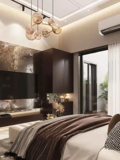 This view of the modern bedroom highlights the custom-designed TV unit with an abstract, textured back panel. The design uses a warm, earthy color palette and sculptural art to create a space that feels both contemporary and comfortable.