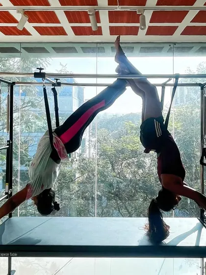 Happy Valentine's Day from our fit family. This inverted partner pose on the Cadillac is a beautiful expression of trust and connection.